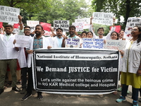 Medical students and doctors attend a protest rally against the rape and murder of a PGT woman doctor at Government-run R G Kar Medical Coll...