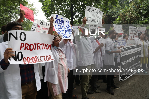 Medical students and doctors attend a protest rally against the rape and murder of a PGT woman doctor at Government-run R G Kar Medical Coll...