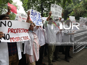 Medical students and doctors attend a protest rally against the rape and murder of a PGT woman doctor at Government-run R G Kar Medical Coll...