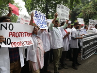 Medical students and doctors attend a protest rally against the rape and murder of a PGT woman doctor at Government-run R G Kar Medical Coll...