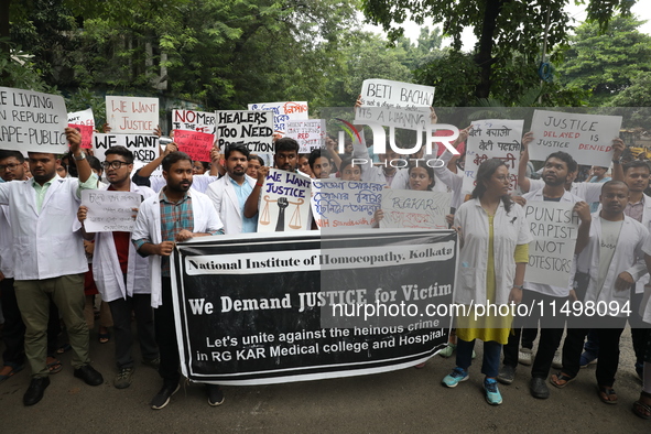 Medical students and doctors attend a protest rally against the rape and murder of a PGT woman doctor at Government-run R G Kar Medical Coll...