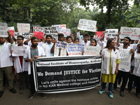 Medical students and doctors attend a protest rally against the rape and murder of a PGT woman doctor at Government-run R G Kar Medical Coll...