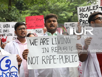 Medical students and doctors attend a protest rally against the rape and murder of a PGT woman doctor at Government-run R G Kar Medical Coll...