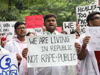 Medical students and doctors attend a protest rally against the rape and murder of a PGT woman doctor at Government-run R G Kar Medical Coll...