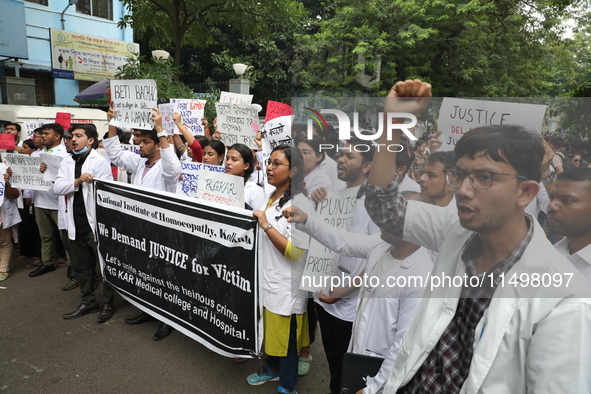 Medical students and doctors attend a protest rally against the rape and murder of a PGT woman doctor at Government-run R G Kar Medical Coll...