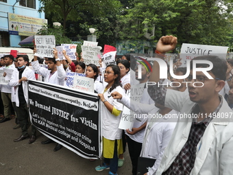 Medical students and doctors attend a protest rally against the rape and murder of a PGT woman doctor at Government-run R G Kar Medical Coll...