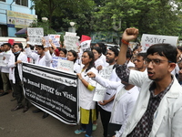 Medical students and doctors attend a protest rally against the rape and murder of a PGT woman doctor at Government-run R G Kar Medical Coll...