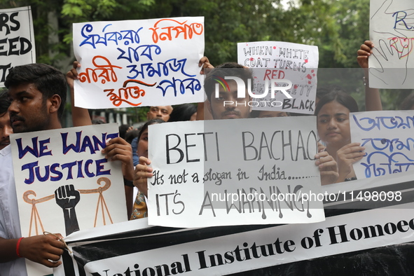 Medical students and doctors attend a protest rally against the rape and murder of a PGT woman doctor at Government-run R G Kar Medical Coll...