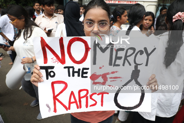 Medical students and doctors attend a protest rally against the rape and murder of a PGT woman doctor at Government-run R G Kar Medical Coll...