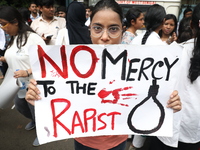 Medical students and doctors attend a protest rally against the rape and murder of a PGT woman doctor at Government-run R G Kar Medical Coll...