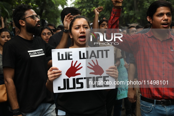 Medical students and doctors attend a protest rally against the rape and murder of a PGT woman doctor at Government-run R G Kar Medical Coll...