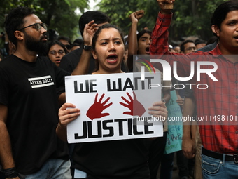 Medical students and doctors attend a protest rally against the rape and murder of a PGT woman doctor at Government-run R G Kar Medical Coll...