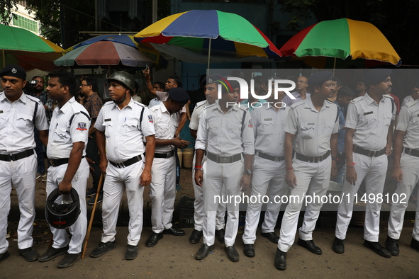 The police force deploys while medical students and doctors attend a protest rally against the rape and murder of a PGT woman doctor at Gove...