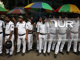 The police force deploys while medical students and doctors attend a protest rally against the rape and murder of a PGT woman doctor at Gove...