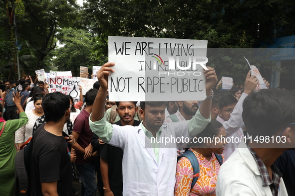 Medical students and doctors attend a protest rally against the rape and murder of a PGT woman doctor at Government-run R G Kar Medical Coll...