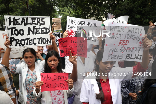 Medical students and doctors attend a protest rally against the rape and murder of a PGT woman doctor at Government-run R G Kar Medical Coll...