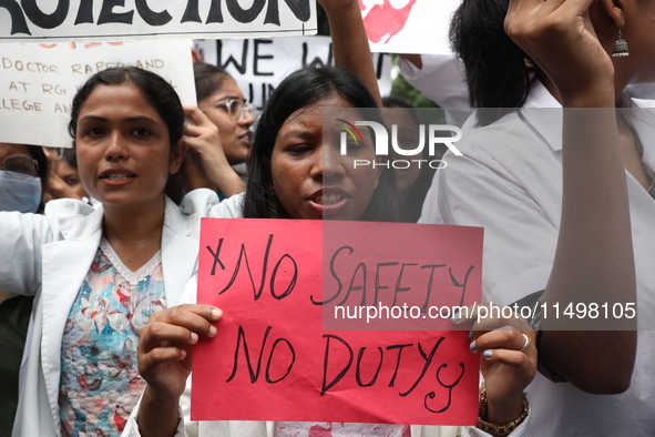 Medical students and doctors attend a protest rally against the rape and murder of a PGT woman doctor at Government-run R G Kar Medical Coll...