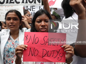 Medical students and doctors attend a protest rally against the rape and murder of a PGT woman doctor at Government-run R G Kar Medical Coll...