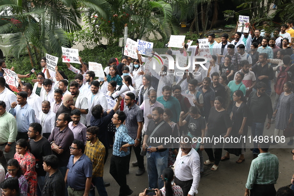 Medical students and doctors attend a protest rally against the rape and murder of a PGT woman doctor at Government-run R G Kar Medical Coll...