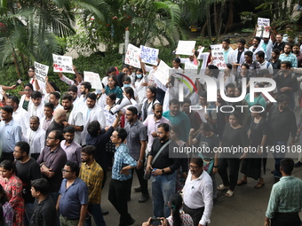 Medical students and doctors attend a protest rally against the rape and murder of a PGT woman doctor at Government-run R G Kar Medical Coll...