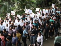 Medical students and doctors attend a protest rally against the rape and murder of a PGT woman doctor at Government-run R G Kar Medical Coll...