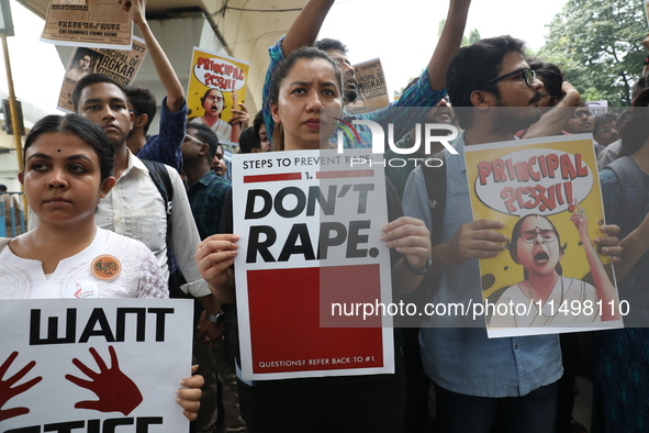 Medical students and doctors attend a protest rally against the rape and murder of a PGT woman doctor at Government-run R G Kar Medical Coll...