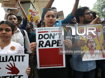 Medical students and doctors attend a protest rally against the rape and murder of a PGT woman doctor at Government-run R G Kar Medical Coll...