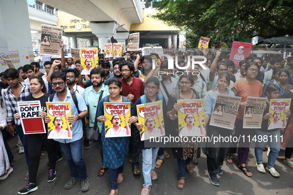 Medical students and doctors attend a protest rally against the rape and murder of a PGT woman doctor at Government-run R G Kar Medical Coll...