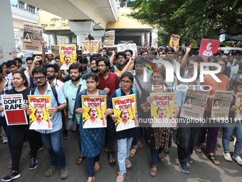 Medical students and doctors attend a protest rally against the rape and murder of a PGT woman doctor at Government-run R G Kar Medical Coll...