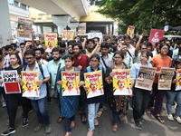 Medical students and doctors attend a protest rally against the rape and murder of a PGT woman doctor at Government-run R G Kar Medical Coll...