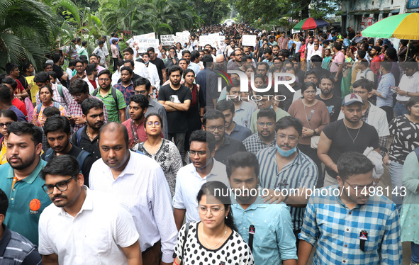 Medical students and doctors attend a protest rally against the rape and murder of a PGT woman doctor at Government-run R G Kar Medical Coll...