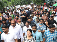 Medical students and doctors attend a protest rally against the rape and murder of a PGT woman doctor at Government-run R G Kar Medical Coll...