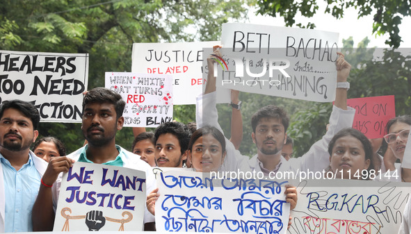 Medical students and doctors attend a protest rally against the rape and murder of a PGT woman doctor at Government-run R G Kar Medical Coll...