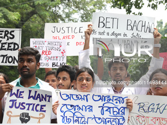 Medical students and doctors attend a protest rally against the rape and murder of a PGT woman doctor at Government-run R G Kar Medical Coll...