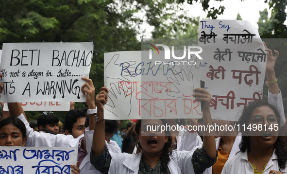 Medical students and doctors attend a protest rally against the rape and murder of a PGT woman doctor at Government-run R G Kar Medical Coll...