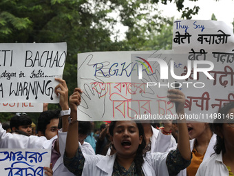 Medical students and doctors attend a protest rally against the rape and murder of a PGT woman doctor at Government-run R G Kar Medical Coll...