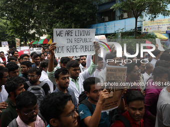 Medical students and doctors attend a protest rally against the rape and murder of a PGT woman doctor at Government-run R G Kar Medical Coll...