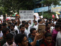 Medical students and doctors attend a protest rally against the rape and murder of a PGT woman doctor at Government-run R G Kar Medical Coll...