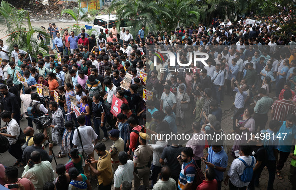 Medical students and doctors attend a protest rally against the rape and murder of a PGT woman doctor at Government-run R G Kar Medical Coll...