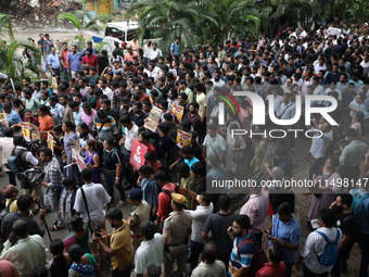 Medical students and doctors attend a protest rally against the rape and murder of a PGT woman doctor at Government-run R G Kar Medical Coll...