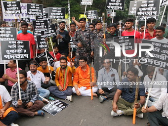 Writers, actors, artists, and film directors participate in a protest rally against the rape and murder of a PGT woman doctor at Government-...