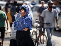 Palestinians flee with their belongings in Deir el-Balah, Gaza Strip, on August 21, 2024, amid the ongoing conflict between Israel and the H...