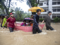 On August 21, 2024, in Feni, Bangladesh, volunteers in the Munsirhat area of Feni district in the Chittagong division of Bangladesh take wom...