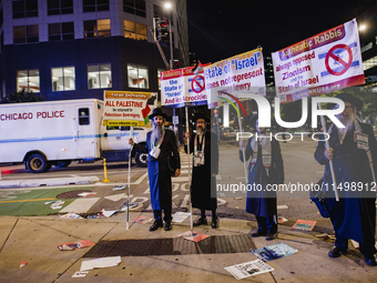 Pro-Palestine protesters hold a ''Make it Great Like '68'' protest in front of the Israeli consulate in Chicago, United States, on August 20...