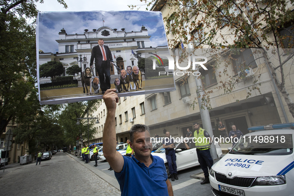 Protesters march and blockade the key intersection Eagle's Bridge in Sofia, Bulgaria, on August 21, 2024, demanding the resignation of caret...