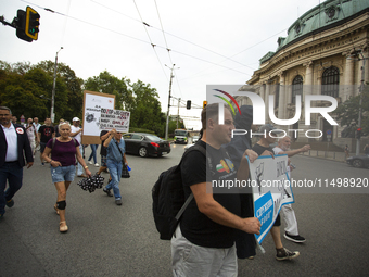 Protesters march and blockade the key intersection Eagle's Bridge in Sofia, Bulgaria, on August 21, 2024, demanding the resignation of caret...