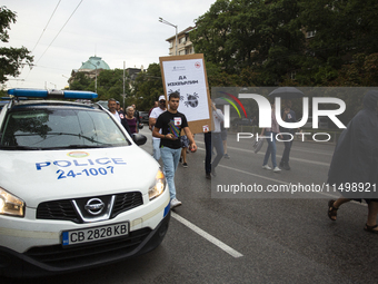 Protesters march and blockade the key intersection Eagle's Bridge in Sofia, Bulgaria, on August 21, 2024, demanding the resignation of caret...