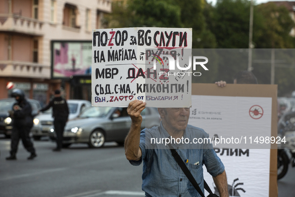 Protesters march and blockade the key intersection Eagle's Bridge in Sofia, Bulgaria, on August 21, 2024, demanding the resignation of caret...