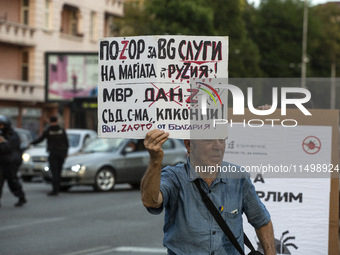 Protesters march and blockade the key intersection Eagle's Bridge in Sofia, Bulgaria, on August 21, 2024, demanding the resignation of caret...