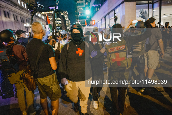 Pro-Palestine protesters hold a ''Make it Great Like '68'' protest in front of the Israeli consulate in Chicago, United States, on August 20...